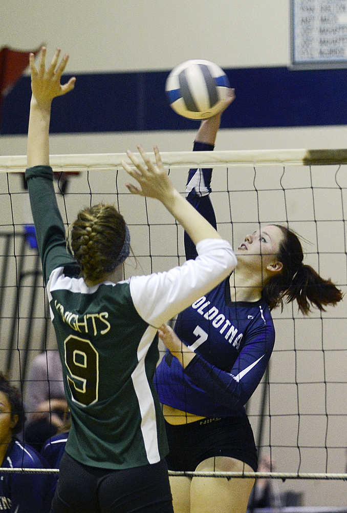 Photo by Rashah McChesney/Peninsula Clarion  Soldotna's Makenna Rosin tips the ball over the net during a game against Colony on Thursday Sept. 17, 2015 in Soldotna, Alaska.