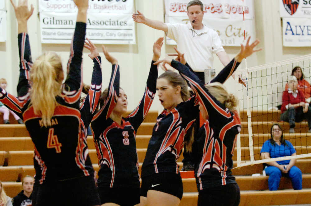 Ben Boettger/Peninsula Clarion The Kenai Central High School Volleyball team celebrates after scoring against Wasilla in a game on Friday, September 18 at Kenai Central High School.