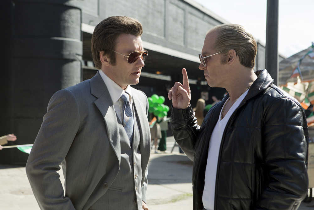 In this image released by Warner Bros. Entertainment, Joel Edgerton portrays John Connolly, left, and Johnny Depp portrays Whitey Bulger in the Boston-set film, "Black Mass." (Claire Folger/Warner Bros. Entertainment via AP)