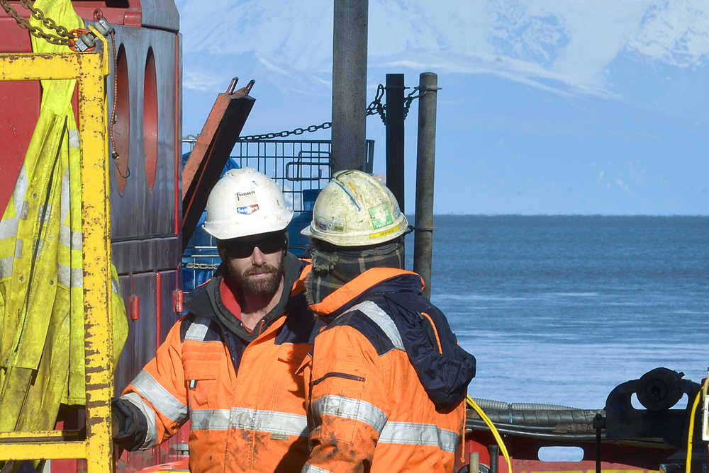 Photo by Rashah McChesney/Peninsula Clarion  Adam Cook and Jeremy Barfield, drillers for Alaska LNG contractor Fugro work on a small jackup rig docked at the Rig Tenders Marine Terminal on Thursday Sept. 24, 2015 in Nikiski, Alaska. As the company continues its fieldwork near the planned location of a proposed LNG plant marine terminal crews will move the rig to a location near Boulder Point to continue geotechnical sampling while others will do seismic work down Holt Lamplight Road.