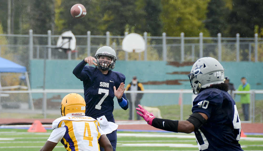 Photo by Rashah McChesney/Peninsula Clarion  Soldotna's Brandon Crowder throws  to Keola Finau during their game against Lathrop on Saturday Sept. 26, 2015 in Soldotna, Alaska.