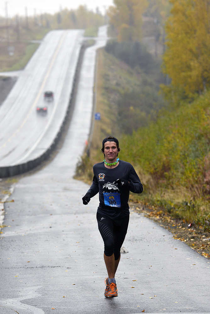 Photo by Rashah MCChesney/Peninsula Clarion Allan Spangler, of Anchorage, held a lengthy lead over the other 54 marathon runners in the Kenai River Marathon for the last half of the race on Sunday Sept. 27, 2015 in Kenai, Alaska. Spangler won the marathon with a time of 2:36:42.