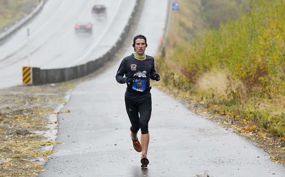Photo by Rashah MCChesney/Peninsula Clarion Allan Spangler, of Anchorage, held a lengthy lead over the other 54 marathon runners in the Kenai River Marathon for the last half of the race on Sunday Sept. 27, 2015 in Kenai, Alaska. Spangler won the marathon with a time of 2:36:42.