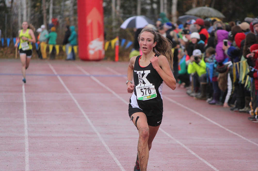 Photo by Joey Klecka/Peninsula Clarion Kenai Central sophomore Riana Boonstra closes in on the finish line to take second place in Saturday's Class 4A girls state championship race at Bartlett High School in Anchorage. The Kenai girls won their first cross-country team championship in school history.