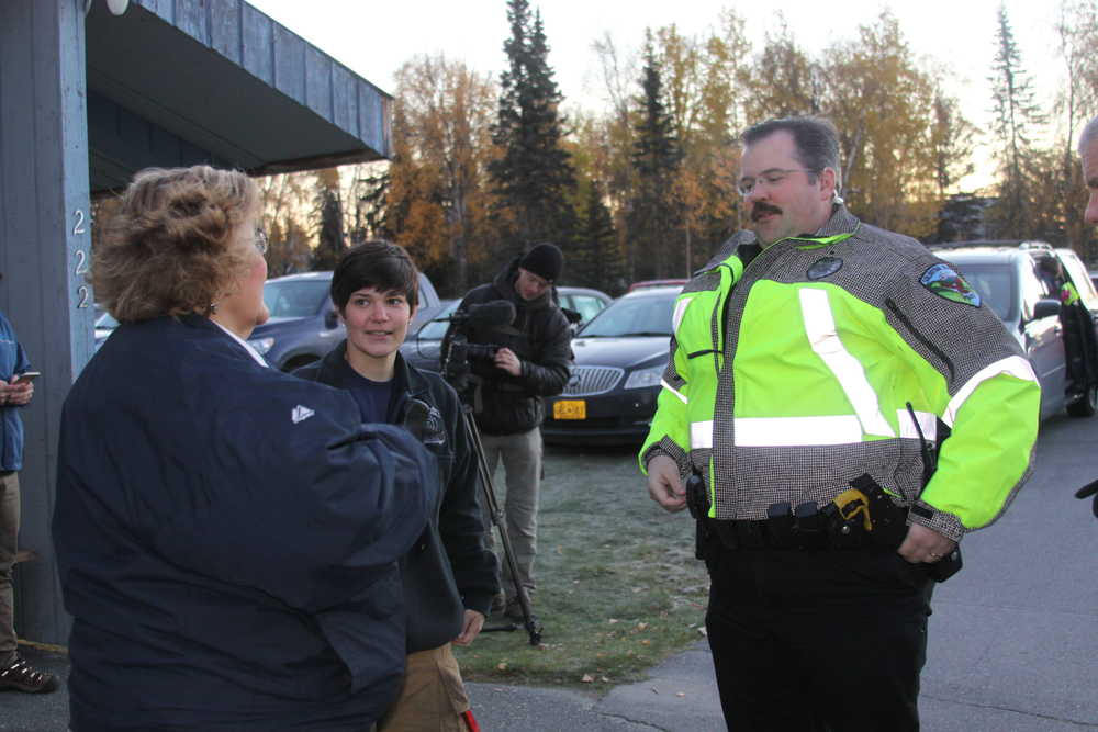 Soldotna Police Department and Central Emergency Services representatives discuss Walk to School route with coordinator Sharon Hale.