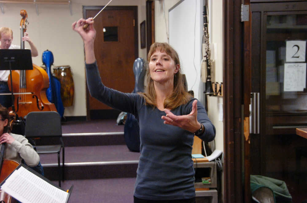 Photo by Megan Pacer/Peninsula Clarion Kenai Peninsula Orchestra Artistic Director Tammy Vollom-Matturro leads orchestra members in a run-through of their concert on Thursday, Oct. 1, 2015, at Kenai Central High School.