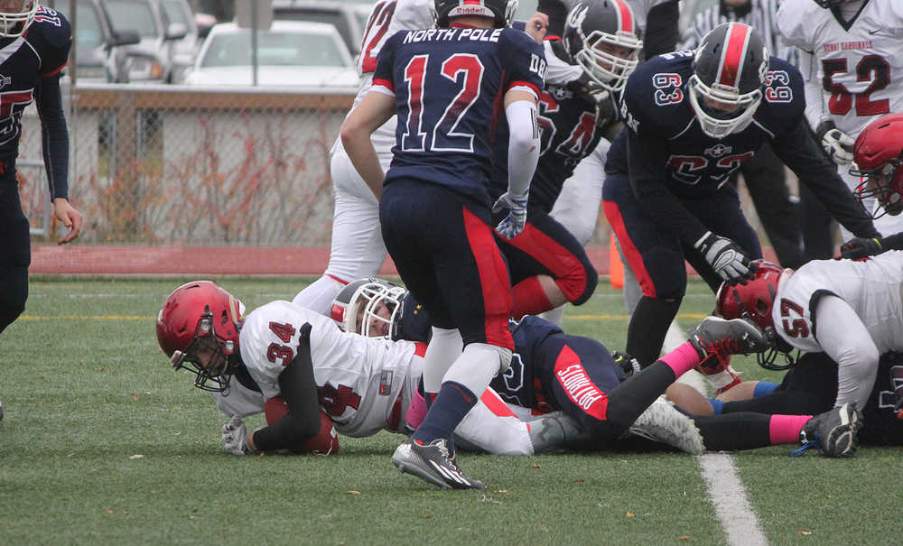 Photo by Joey Klecka/Peninsula Clarion Kenai Central running back Draiden McMinn (34) dives into the endzone for a touchdown against North Pole, Saturday at Dimond Alumni Field in Anchorage.