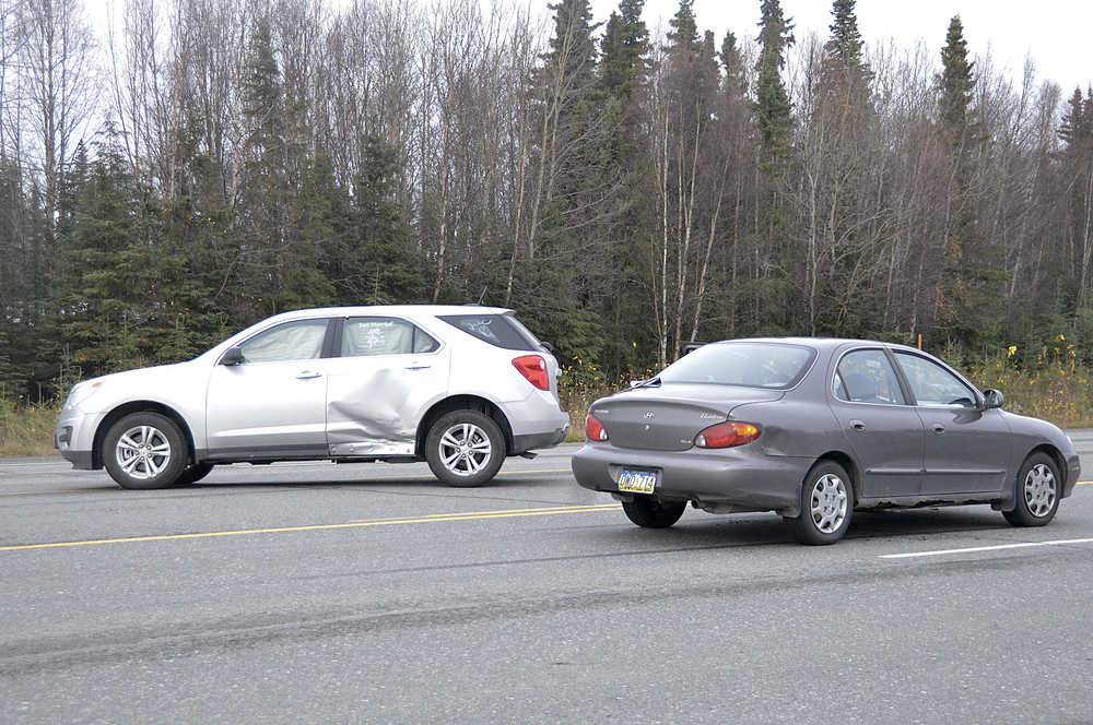 Photo by Megan Pacer/Peninsula Clarion An accident Sunday Oct. 11, 2015 slowed traffic on the Kenai Spur Highway near its intersection with Linwood in Kenai, Alaska. No one was injured.