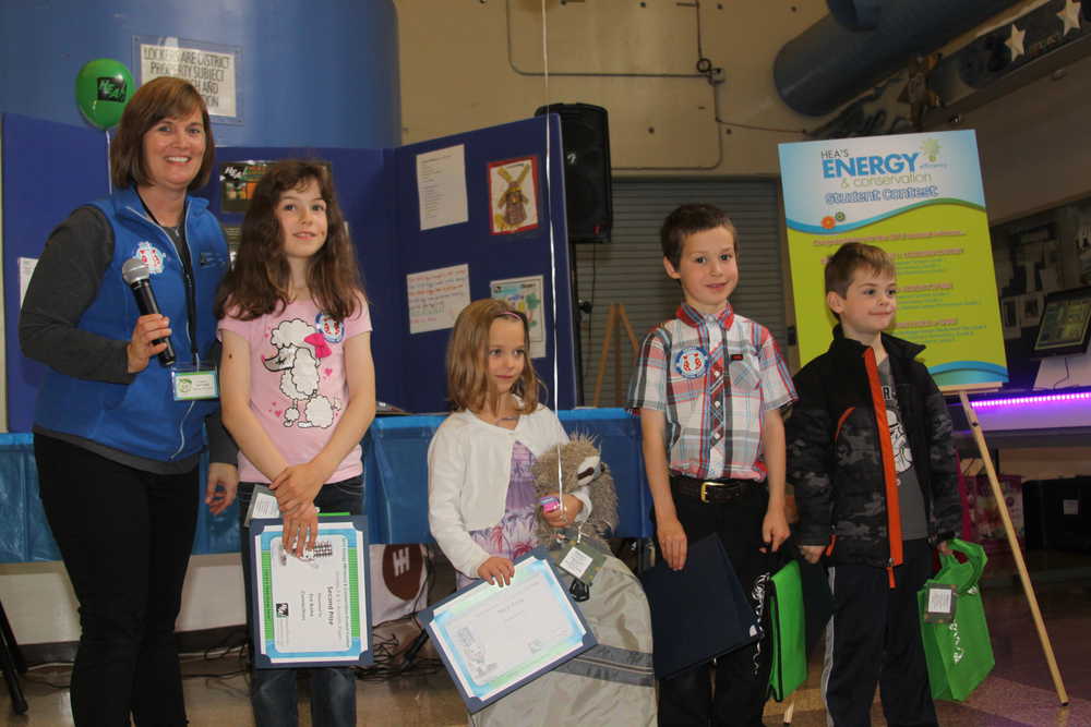 Students claim prizes in HEA's energy contest.
