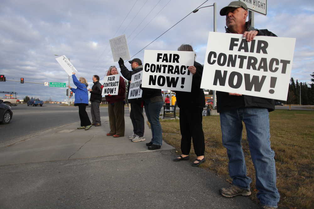 Photo by Kelly Sullivan/ Peninsula Clarion Wayne Cowan said he attended a teachers rally Wednesday, Oct. 14, 2015, on Main Street Loop in Kenai, Alaska. The gathering was organize by representatives from the Kenai Peninsula Education and Kenai Peninsula Education Support associations prior to a meeting between the two group's negotiating teams and the Kenai Peninsula Borough School District that same evening.