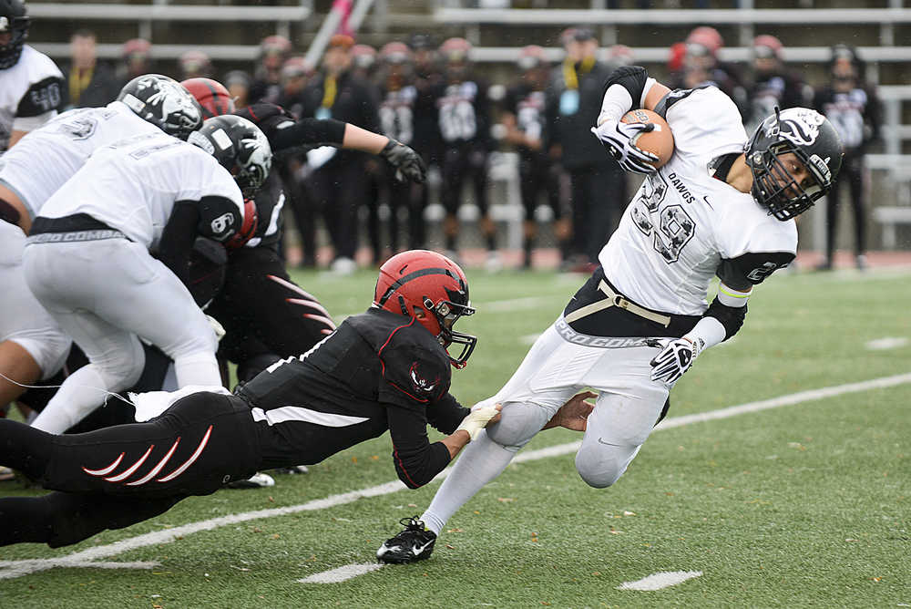 Photo by Rashah McChesney/Peninsula Clarion Nikiski's Corin Cooper gets depantsed by Eielson's Tobias Dobashi-Noa during their small schools state championship game on Saturday Oct. 17, 2015 in Anchorage, Alaska.