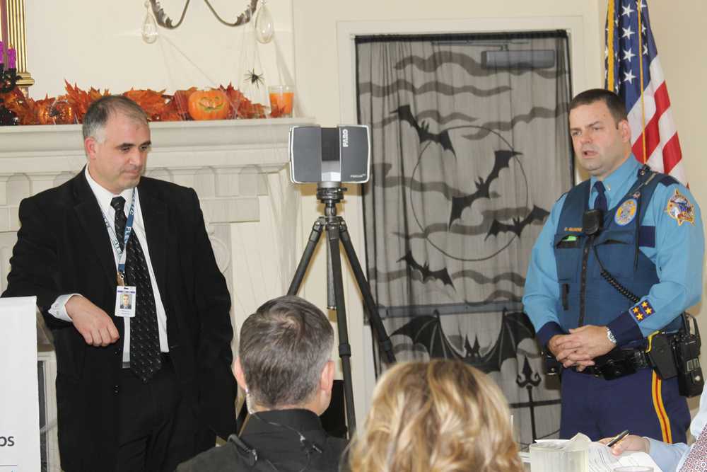 AST Lt. Gilmore AST Investigator Ramin Dunford demonstrates new 3-D laser scanner at a Soldotna Chamber of Commerce luncheon.