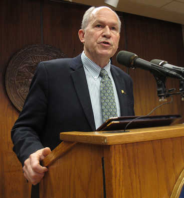 FILE - In this Friday, Oct. 23, 2015 file photo, Alaska Gov. Bill Walker speaks to reporters on the eve of the start of a special legislative session in Juneau, Alaska. The Alaska Legislature is meeting in special session to consider buying out TransCanada Corp.'s position in a major liquefied natural gas project the state is pursuing with other partners. (AP Photo/Becky Bohrer, file)