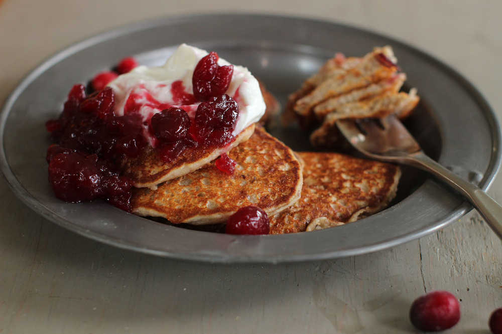 This October 5, 2015 photo shows cranberry sauce, oat and flax pancakes in Concord, NH. Making your own cranberry sauce this holiday is incredibly easy and it allows you to cut the sugar content in half without anyone missing it.  (AP Photo/Matthew Mead)