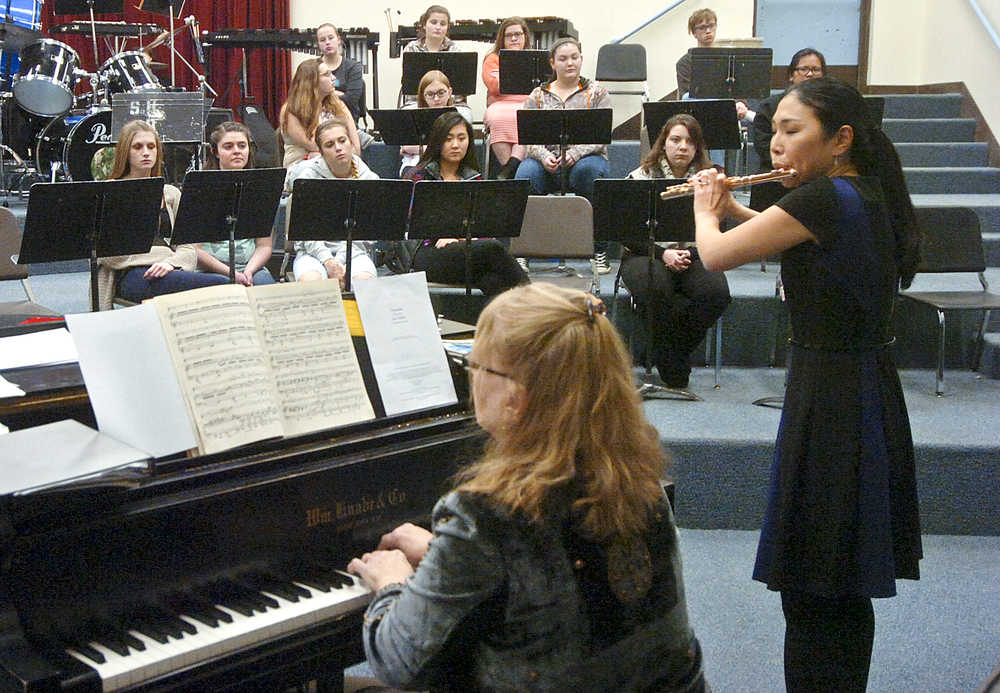 Photo by Rashah McChesney/Peninsula Clarion Pianist Maria Allison and flutist Tomoka Raften play for a band class on Wednesday Nov. 4, 2015 in Soldotna, Alaska. The two will perform on Nov. 7 at the Soldotna Christ Lutheran Church.