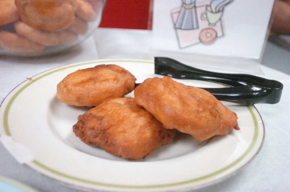 Photo by Megan Pacer/Peninsula Clarion Students and area residents enjoyed locally-made fry bread during the kick-off event for Alaska Native/Native American Heritage Month on Thursday, Nov. 5, 2015 in the McLane Commons at Kenai Peninsula College.