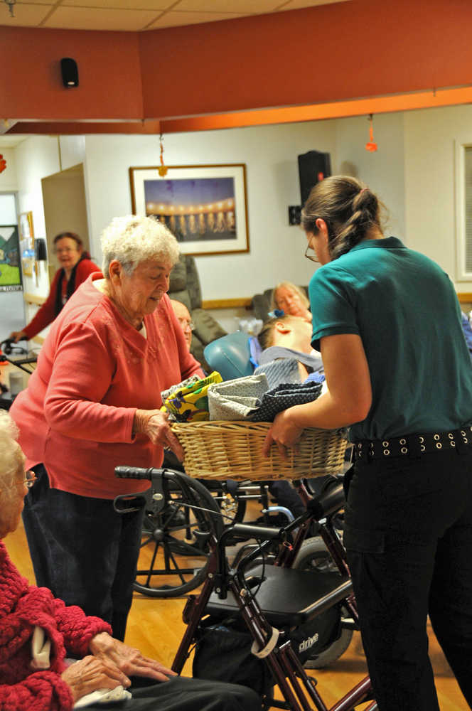 The residents of Heritage Place, a nursing home in Soldotna, hand-sewed blankets and toys for the cats at the Soldotna Animal Shelter and presented them to Amanda Alaniz, the assistant animal control officer, on Friday.