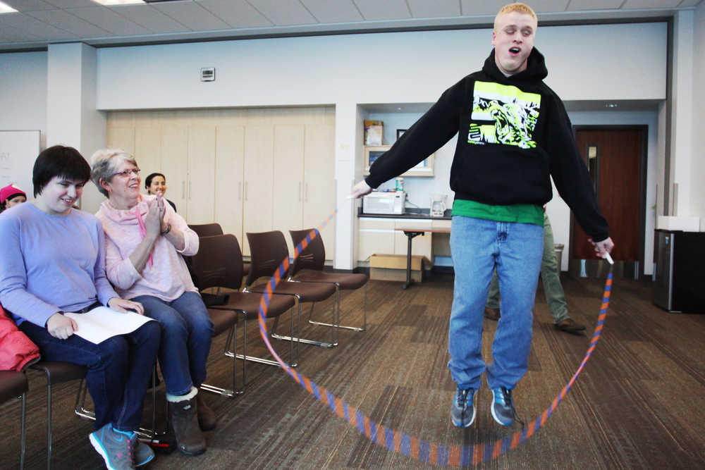 Ben Boettger/Peninsula Clarion Malakai Hansen, demonstrating sports skills he learned with his visual impairment, jumps rope during the Kenai Peninsula School District's Celebraille event on Friday, Nov. 6 at the Soldotna Public Library.