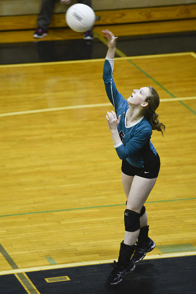 Photo by Rashah McChesney/Peninsula Clarion  Emily Hensley serves during Nikiski volleyball's game against Houston on Friday Nov. 6, 2015 in Nikiski, Alaska.