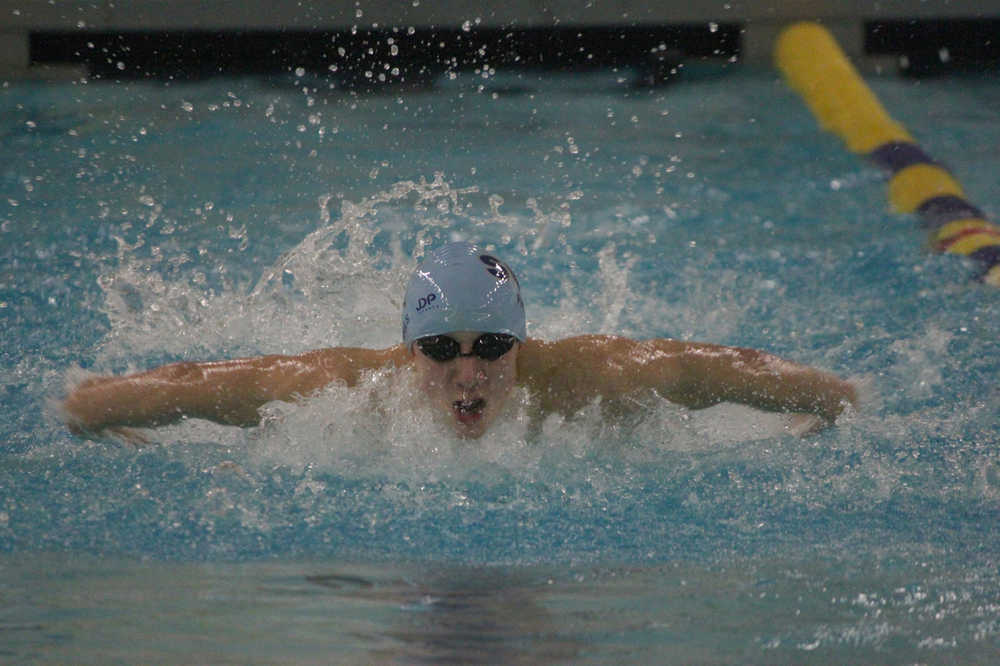 Photo by Joey Klecka/Peninsula Clarion Soldotna's Cody Watkins competes in the 100-yard butterfly Saturday at the state swimming and diving meet at Bartlett High School in Anchorage.