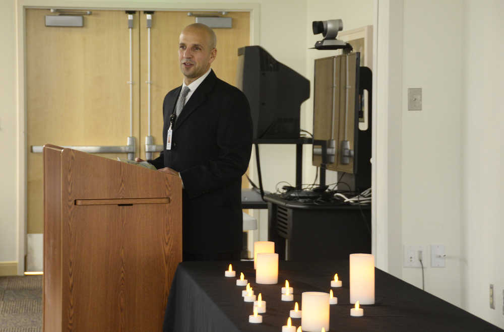 Photo by Megan Pacer/Peninsula Clarion Spiritual Care Coordinator Frank Alioto leads residents and health care staff members through the annual Time of Remembrance celebration on Sunday, Nov. 8, 2015 at Central Peninsula Hospital in Soldotna, Alaska.