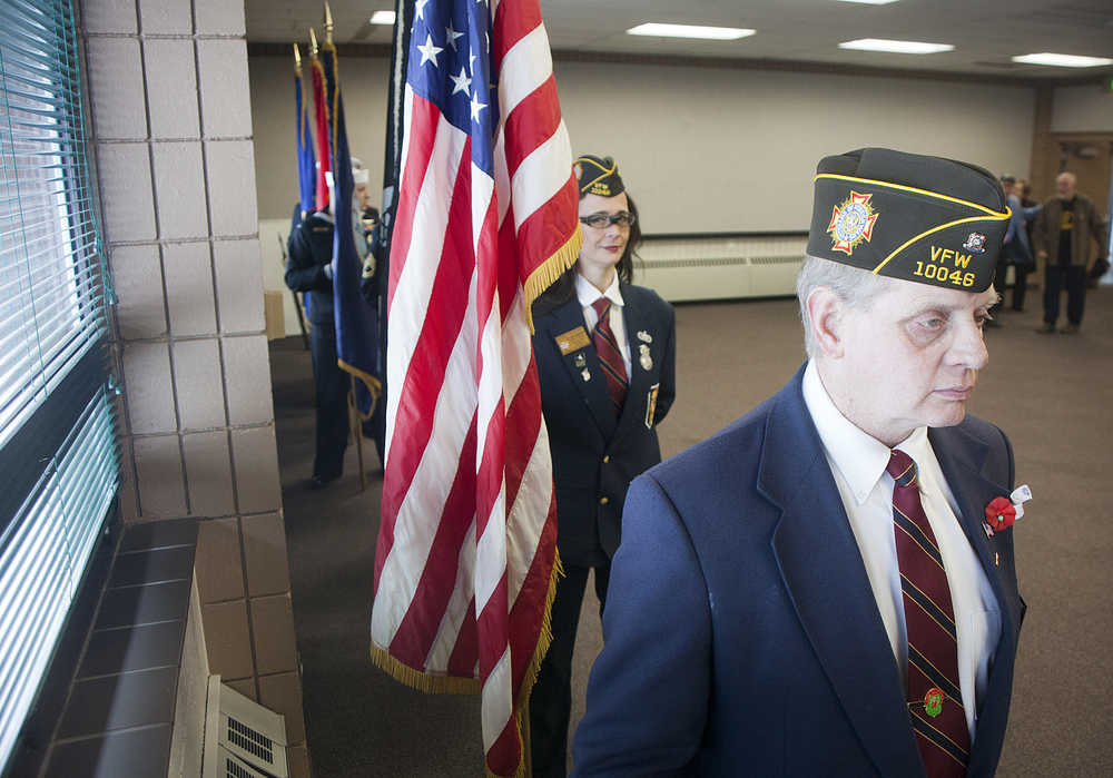 Photo by Rashah McChesney/Peninsula Clarion Members of Kenai's American Legion Post 20 salute during the posting of the colors at a Veterans Day ceremony on Wednesday Nov. 11, 2015 in Soldotna, Alaska.