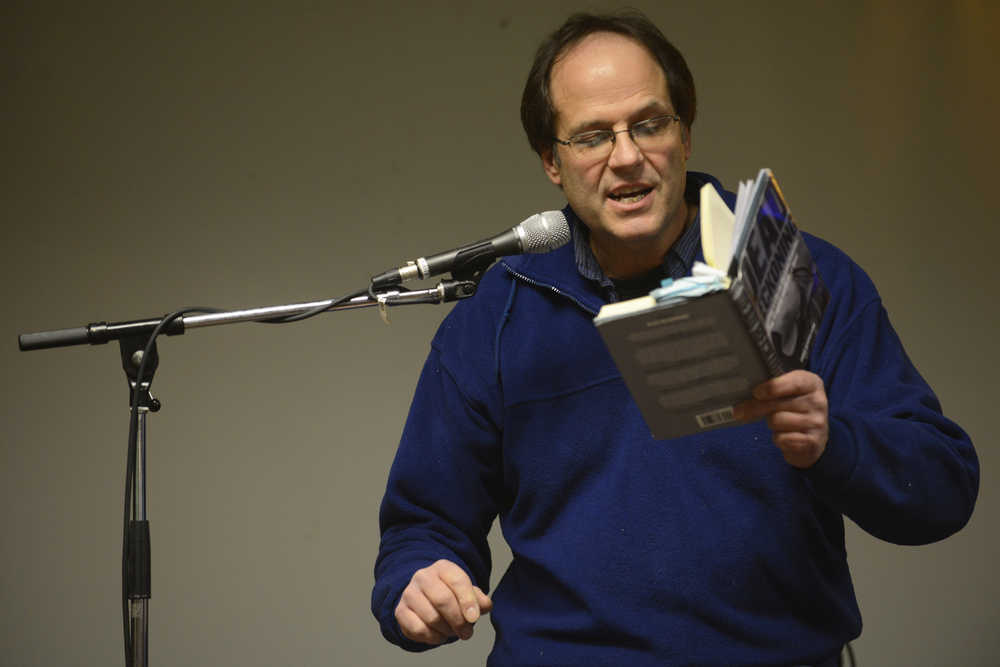 Photo by Megan Pacer/Peninsula Clarion Local writer Dave Atcheson reads excerpts from his books on his experiences sports and commercial fishing on Tuesday, Nov. 17, 2015 during a Trout Unlimited meeting at Odie's Deli in Soldotna, Alaska.
