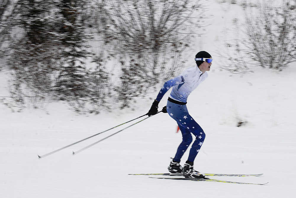 Photo by Rashah McChesney/Peninsula Clarion  Soldotna High School's Levi Michael finishes second during a race between three Kenai Peninsula high schools on Saturday Dec. 6, 2014 at the Tsalteshi Trails in Soldotna, Alaska.