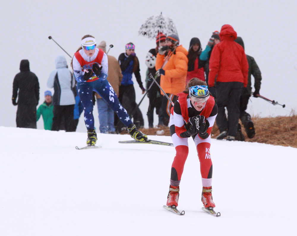 Photo by Caitlin Skvorc/Frontiersman.com Kenai Central's Addison Gibson leads Soldotna's Sadie Fox over a hill in the first leg of the girls 4-by-3-kilometer relay Saturday at the state Nordic ski championships at Kincaid Park in Anchorage. Gibson finished the leg in third, while Fox was in fourth.