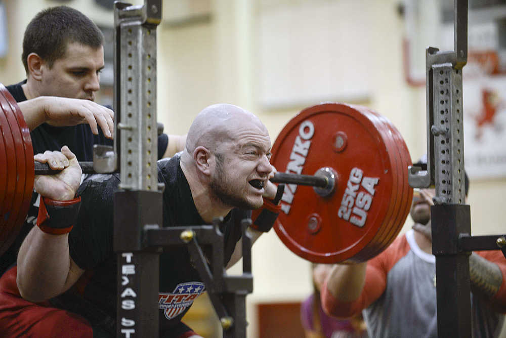 Photo by Rashah McChesney/Peninsula Clarion Donald Staton, of soldotna, successfully squats 469 pounds during the Dena'ina Powerlifting Meet on Saturday Nov. 21, 2015 at Kenai Central High School in Kenai, Alaska.