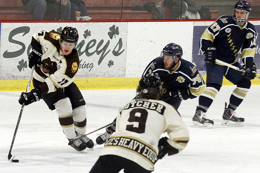 Photo by Rashah McChesney/Peninsula Clarion  Brown Bears' Jack Gessert outmaneuvers Janesville Jets' Taylor Fernandez during their game on Friday Nov. 20, 2015 in Soldotna, Alaska.