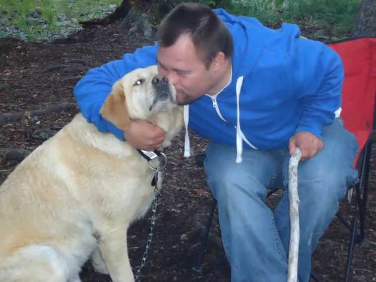 Kyle Heffner shares a hug and a smooch with the family dog, Nugget. They love to camp and play. (Submitted photo)