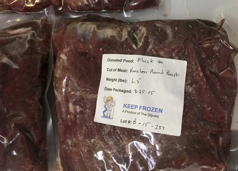 This Sept. 4, 2015 photo released by the U.S. Public Health Service shows a package of donated musk ox meat in Kotzebue, Alaska. Now that the long-term senior care facility in Kotzebue just began incorporating traditional foods into the regular menu, its Alaska Native residents no longer have to just wait for monthly family potlucks to enjoy the taste of the subsistence foods they grew up with. (Chris Dankmeyer/U.S. Public Health Service via AP)