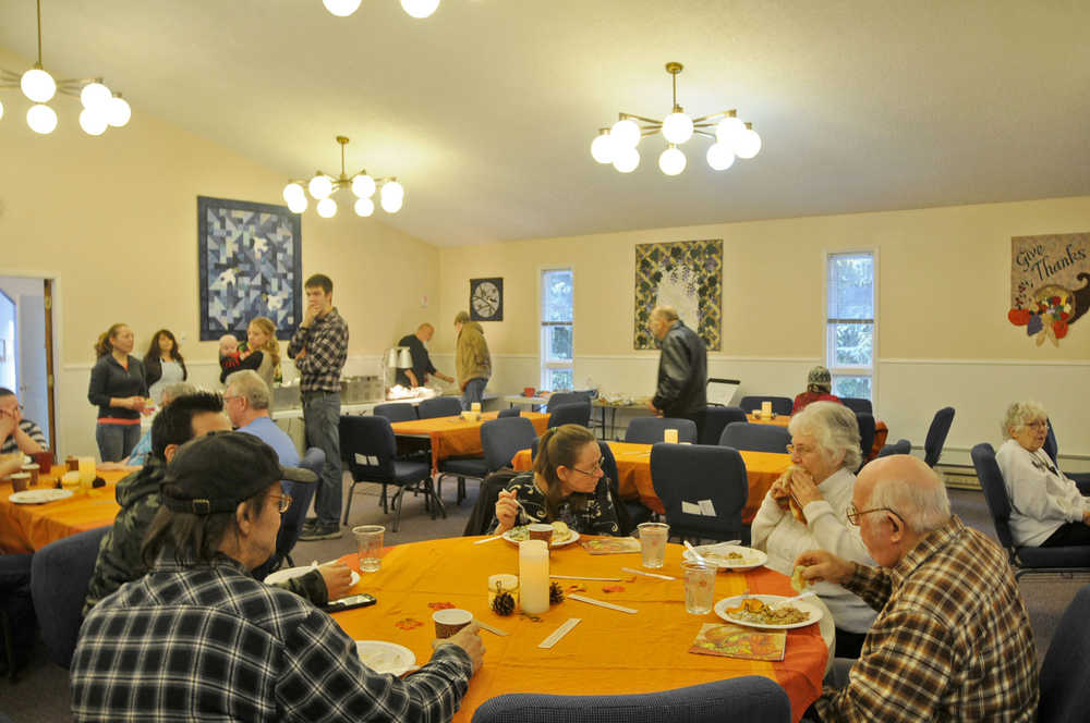 Photo by Elizabeth Earl/The Peninsula Clarion The Kasilof Community Church opened its doors to the public for a free Thanksgiving dinner Thursday. The next-door cafe, Rocky's Cafe, prepared the food, and volunteers served it in the church.