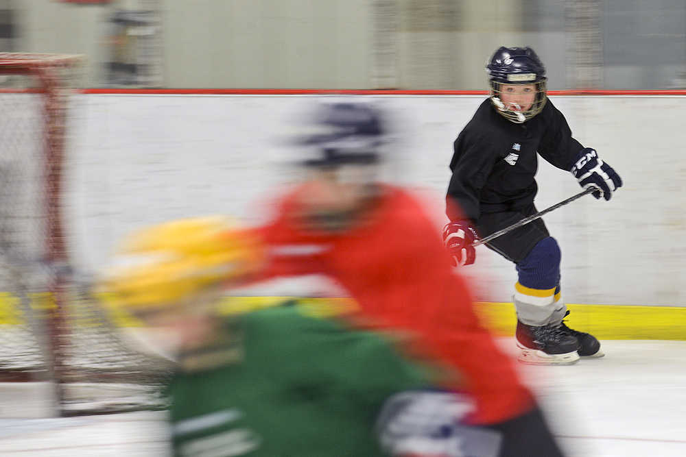 Photo by Rashah McChesney/Peninsula Clarion Members of the Squirt C team practice on Monday Nov. 30, 2015 at the Kenai Multipurpose Recreation Facility in Kenai, Alaska. The team is comprised of players in the third to fifth grades.