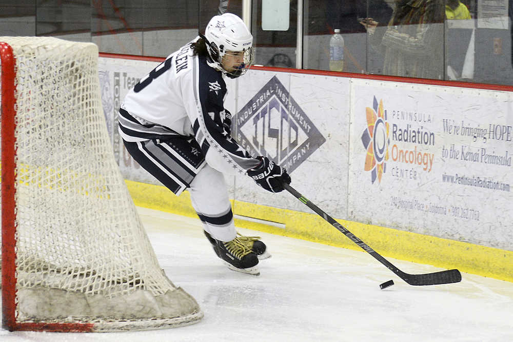 Photo by Rashah McChesney/Peninsula Clarion Soldotna Stars' Cameron Knowlton takes control of the puck during their game against Palmer High School on Friday Dec. 4, 2015 in Soldotna, Alaska.