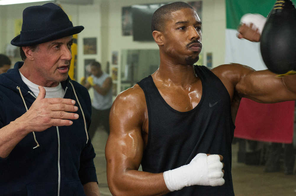 This photo provided by Warner Bros. Pictures shows Michael B. Jordan, right, as Adonis Johnson and Sylvester Stallone as Rocky Balboa in Metro-Goldwyn-Mayer Pictures', Warner Bros. Pictures' and New Line Cinema's drama "Creed," a Warner Bros. Pictures release. The movie opened in U.S. theaters on Nov. 25, 2015. (Barry Wetcher/Warner Bros. Pictures via AP)