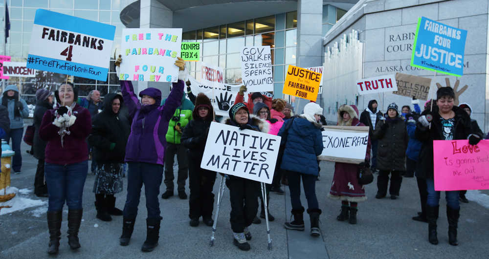 Fairbanks Four supporters rally in front of the Rabinowitz Courthouse in Fairbanks, Alaska, Friday morning, Dec. 11, 2015. A hearing originally scheduled for Friday on the proposed settlement between state prosecutors and the four men seeking exoneration of their murder convictions was canceled. The Four, George Frese, Kevin Pease, Eugene Vent and Marvin Roberts were convicted in the 1997 killing of John Hartman. Roberts was released on parole earlier this year. The other three men remain in custody. (Eric Engman/Fairbanks Daily News-Miner via AP) MANDATORY CREDIT