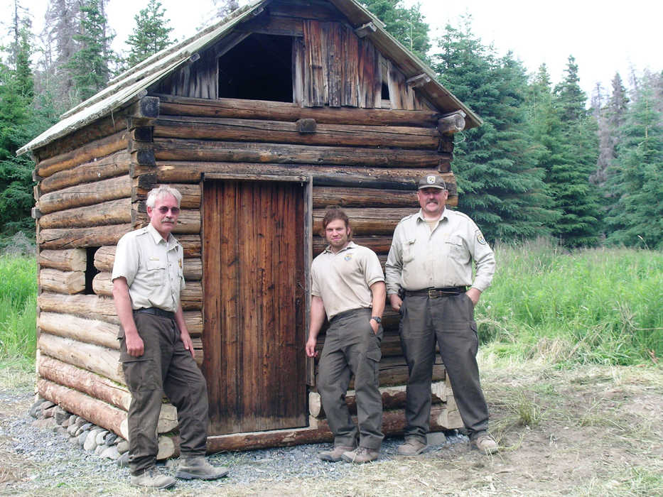 Ranger Gary Titus (left) with Brian Taylor and Ivan Sjodin after restoring the 1920s era sauna at the Moose Creek Cabin on the shores of Tustumena Lake. Gary leaves a legacy of a vibrant cabin management program after 15 years of service at the Kenai National Wildlife Refuge. (Photo courtesy Kenai National Wildlife Refuge)