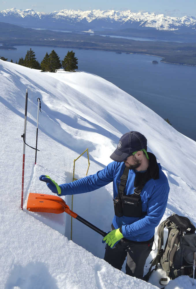 ADVANCE FOR THE WEEKEND OF DEC. 12-13 AND THEREAFTER - In this April 25, 2014 photo, Mike Janes, avalanche forecaster at Alaska Electric Light and Power, assesses snow conditions above the company's Snettisham hydroelectric facility near Juneau, Alaska. The 2015 Southeast Alaska Avalanche Center's Southeast Alaska Snow and Avalanche Workshop featured topics included decision-making, a forecaster's perspective on assessing avalanches, how wind affects snow conditions, emerging technology and the Department of Transportation's programs.  (Bjorn Dihle/The Juneau Empire via AP) MANDATORY CREDIT