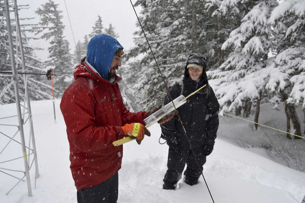 ADVANCE FOR THE WEEKEND OF DEC. 12-13 AND THEREAFTER - In this Feb. 14, 2014 photo, snow experts Mike Janes, left, and Ed Shanley assess conditions on Mount Roberts above Juneau, Alaska. The 2015 Southeast Alaska Avalanche Center's Southeast Alaska Snow and Avalanche Workshop featured topics included decision-making, a forecaster's perspective on assessing avalanches, how wind affects snow conditions, emerging technology and the Department of Transportation's programs.  (Bjorn Dihle/The Juneau Empire via AP) MANDATORY CREDIT