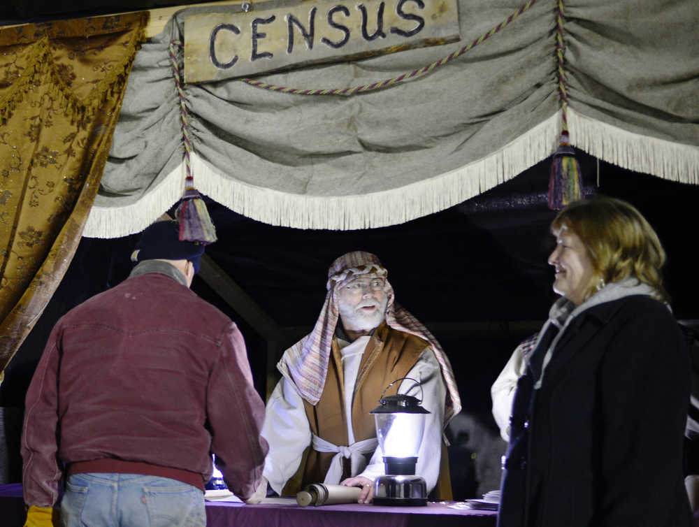 Ben Boettger/Peninsula Clarion  Census-taker Gary Couveau registers new arrivals in Bethlehem on Friday, Dec. 18 at the College Heights Baptist Church in Soldotna.