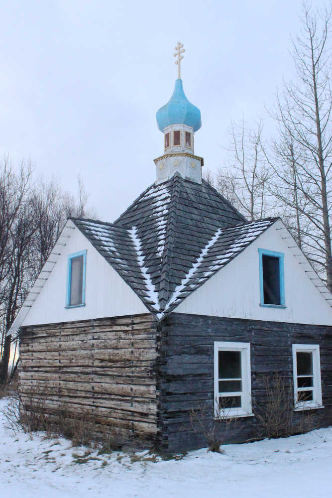 Ben Boettger/Peninsula Clarion St.Nicholas Chapel stands across the street from Holy Assumption of the Virgin Mary Russian Orthodox church on Sunday, Dec. 20 in Old Town Kenai. The wooden chapel will be 110 years old in 2016.