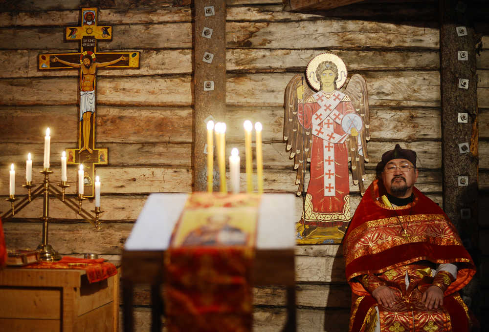 Ben Boettger/Peninsula Clarion Ben Boettger/Peninsula Clarion Father Victor Nick of Ninilchik's Holy Transfiguration of Our Lord Russian Orthodox Church sits during a divine liturgry service in St. Nicholas Chapel on Saturday, Dec. 19 in Kenai.