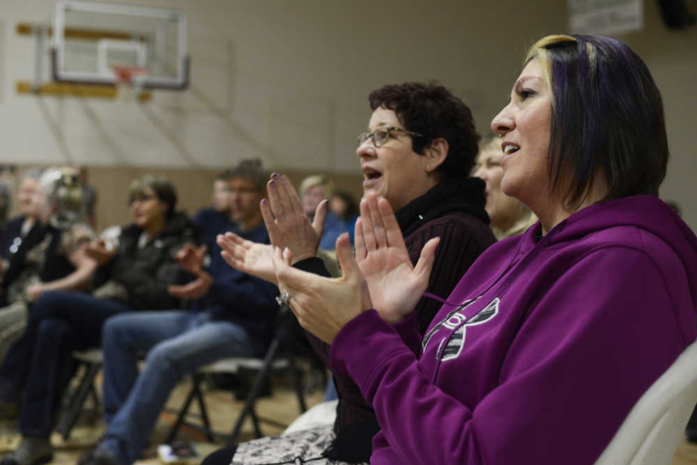 Photo by Megan Pacer/Peninsula Clarion Suraj "White Eagle" Holzwarth performs a song from her latest CD, "Holy Ground" on Sunday, Dec. 20, 2015 at the Sterling Community Center in Sterling, Alaska. Holzwarth and other performers are on a tour to promote the album, which was recorded to honor the foreign countries they visited over the last 20 years.