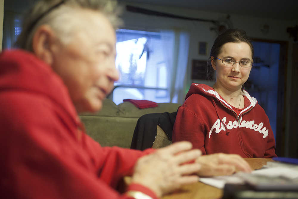 Photo by Rashah McChesney/Peninsula Clarion  Nicole Harmon watches her grandmother Mary Lou Bottorff on Wednesday Dec. 9, 2015 as the two talk to a reporter about Harmon's recovery following a 2003 car accident and seizure in 2011. Despite the challenges, Harmon has graduated high school and is working toward several recovery and life goals.
