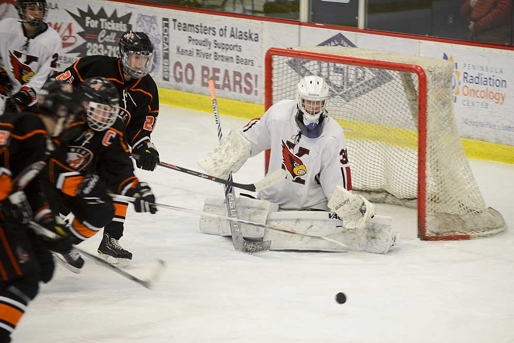 Photo by Rashah McChesney/Peninsula Clarion West High School playerConnor Bateman guards Kenai Central High School's goal - as the team's own goalie was injured - during their game on Friday Jan. 8, 2016 in Soldotna, Alaska.