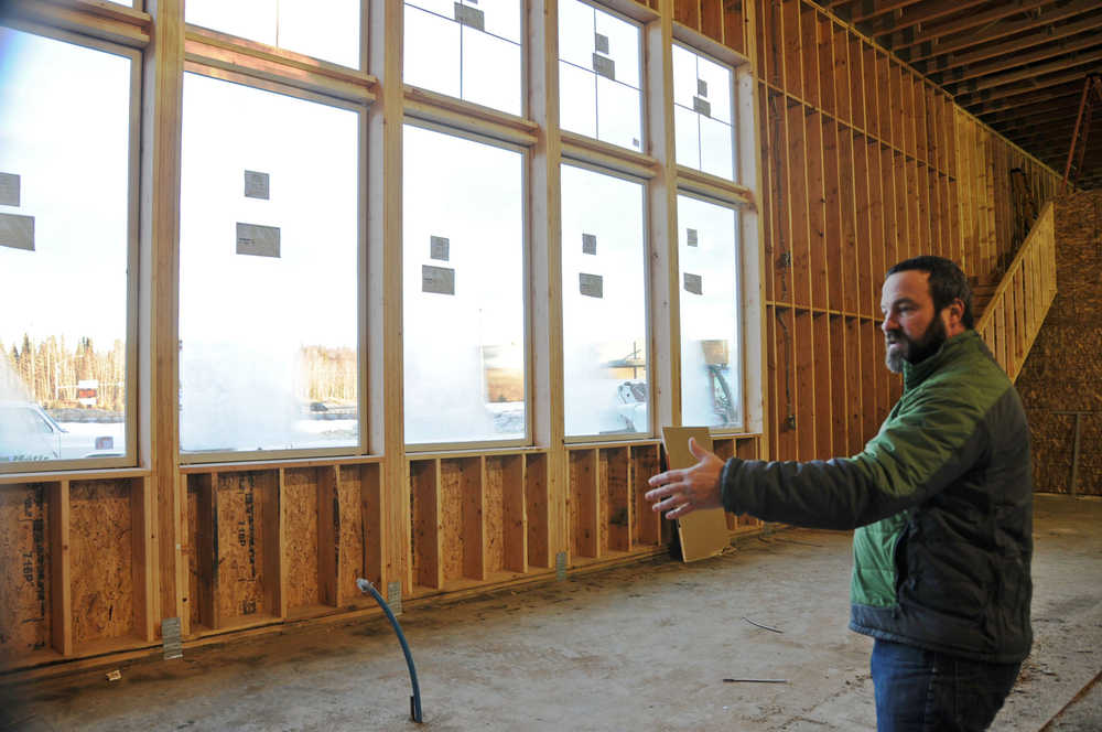 Photo by Elizabeth Earl/Peninsula Clarion Kenai River Brewing Company co-owner Doug Hogue stands in the future brewing space in the brewing company's new building on Forty-Seventh Street in Soldotna.