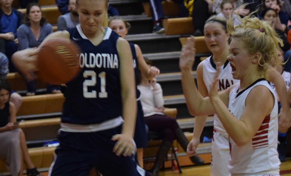 Photo by Jeff Helminiak/Peninsula Clarion Soldotna's Abby Kruse tries to keep the ball inbounds while Kenai Central's Alli Steinbeck defends Tuesday at Kenai Central High School.