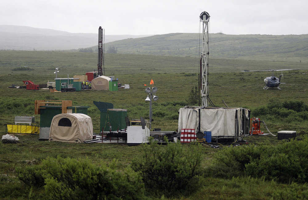 FILE - In this July 13, 2007 file photo, workers with the Pebble Mine project test drill in the Bristol Bay region of Alaska near the village of Iliamma. A watchdog has found no evidence of bias in how the U.S. Environmental Protection Agency conducted a study on the potential effects of large-scale mining on a world-premier salmon fishery in Alaska's Bristol Bay region. The inspector general for the EPA also concluded in a report released Wednesday, Jan. 13, that the agency did not predetermine the study's outcome. (AP Photo/Al Grillo, File)